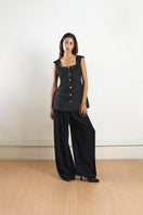 Black fixed corset top by YASSMIN SALEH featuring structured design and front fastening, displayed from the front view.