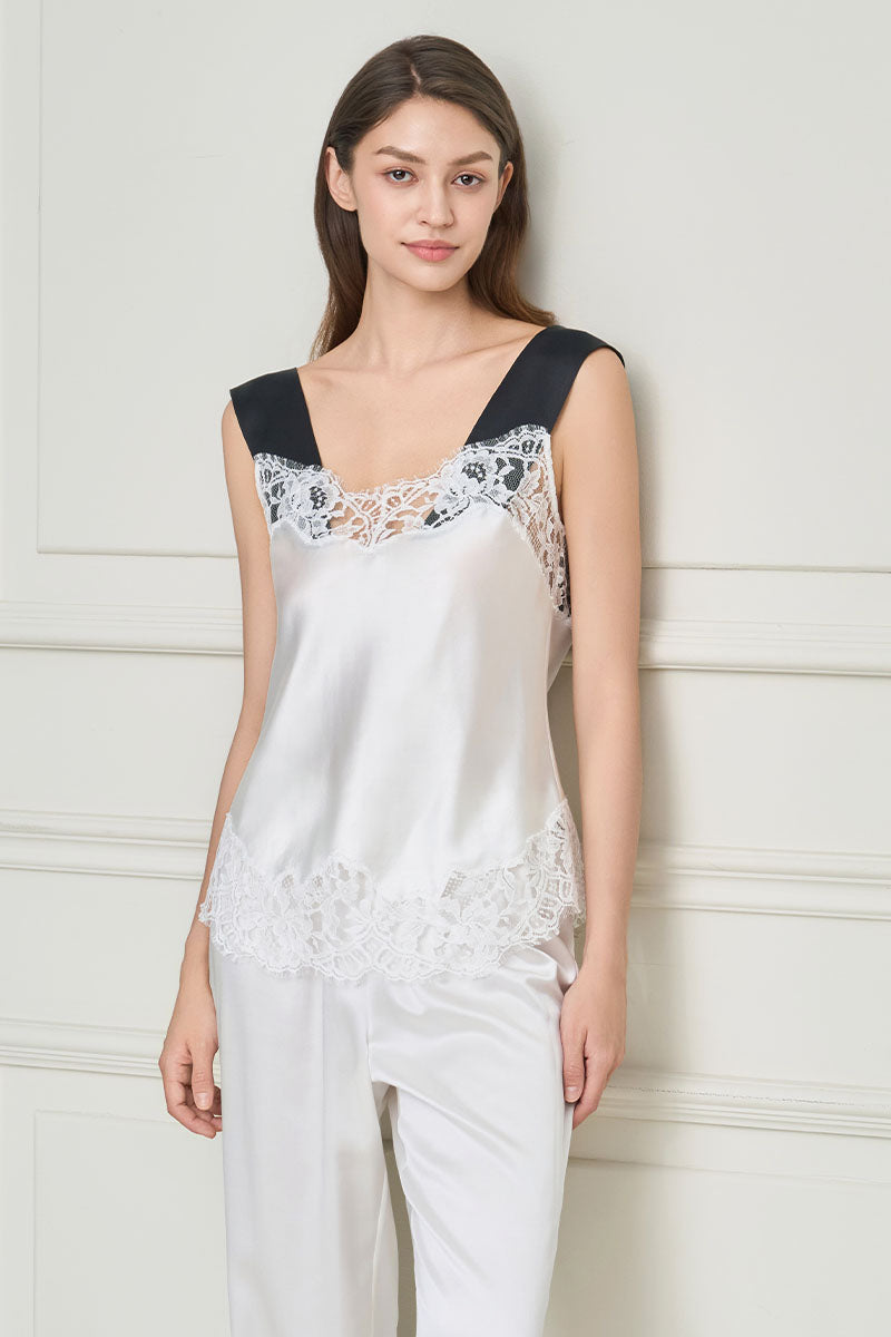 White silk lace women's pajama set by MANITO featuring elegant lace details and a comfortable, relaxed fit.