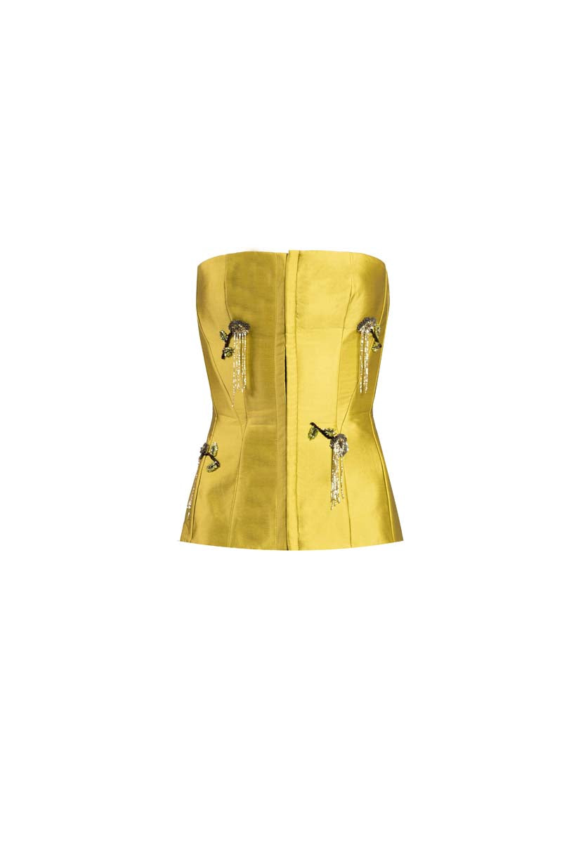 Green flare corset top by YASSMIN SALEH featuring a fitted silhouette and stylish flare design, shown from the front.