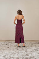 Purple flare corset top by YASSMIN SALEH, showing the back design with flare details and structured fit.
