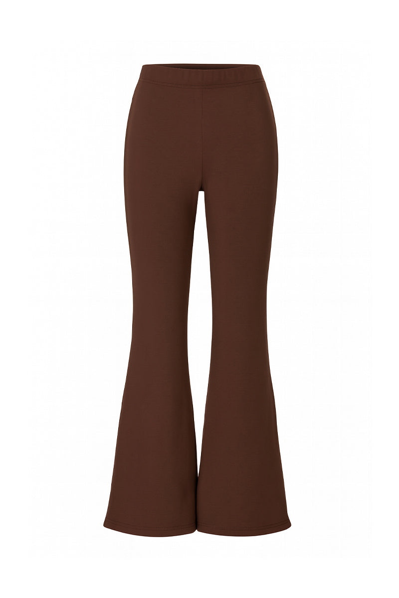 Brown flare sweatpants by Bassigue, featuring a relaxed fit and comfortable fabric, shown on a model in a casual setting.