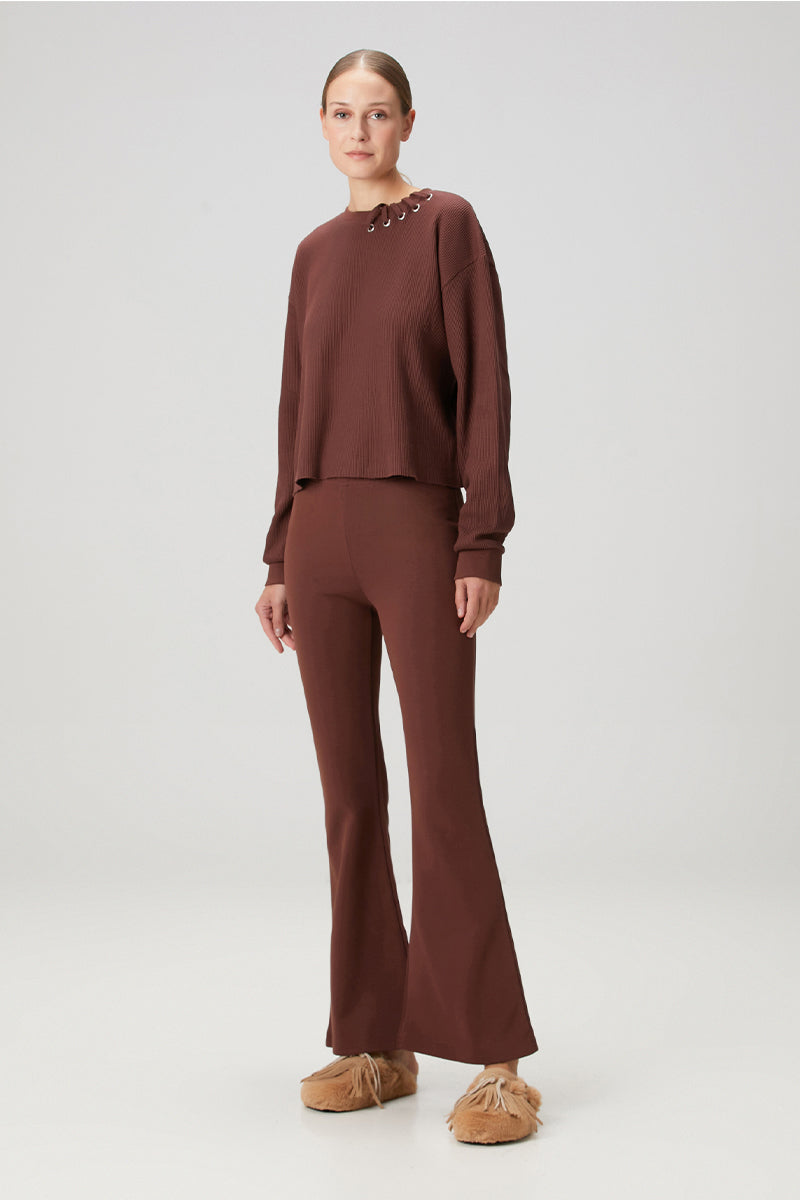 Brown flare sweatpants by Bassigue, relaxed fit with a stylish flare leg design, made from soft, comfortable fabric.