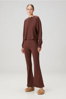 Brown flare sweatpants by Bassigue featuring a relaxed fit and comfortable fabric, ideal for casual wear.