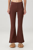 Brown flare sweatpants by Bassigue featuring a relaxed fit and comfortable waistband, styled for casual wear.