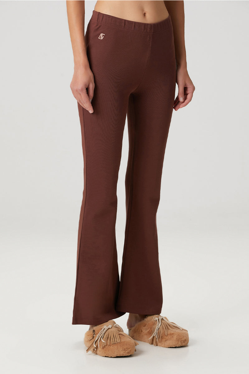Brown flare sweatpants by Bassigue, featuring a relaxed fit and comfortable fabric, shown laid flat on a white background.