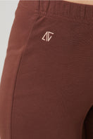 Brown flare sweatpants by Bassigue featuring a relaxed fit and comfortable waistband, perfect for casual wear.