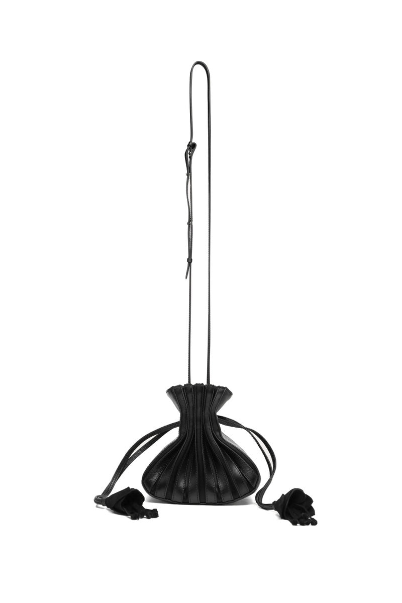 Black TUEAM'S Fleur bag with a chic top handle design, featuring elegant floral-inspired details and a sleek, modern style.