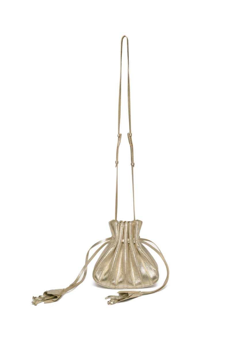 Gold TUEAM'S Fleur top handle bag with floral design, featuring a sleek and elegant appearance.