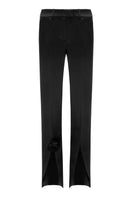 Matters Fleur trousers in black, stylish pants with a tailored fit, shown on a model with a modern, minimalist background.