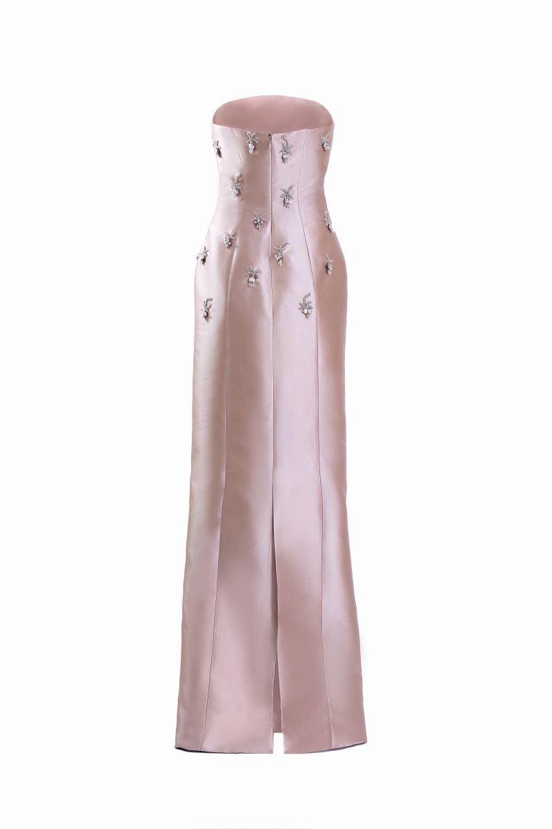 Pink Flicker gown by Yassmin Saleh featuring a ghost back design, elegant fabric, and flowing silhouette.