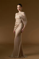 I.H.F Bonnie shimmer jersey gown in beige, floor-length mermaid style with cascading shoulder drape and elegant silhouette.