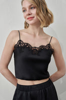 Black Flora Lace Silk Camisole Top by MANITO, featuring delicate lace details and smooth silk fabric, shown on a model.