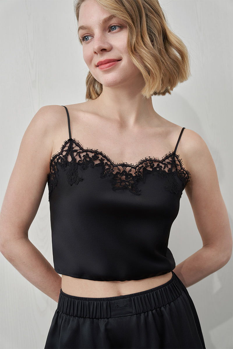 Black Flora Lace Silk Camisole Top by MANITO, featuring delicate lace details and smooth silk fabric, shown on a model.