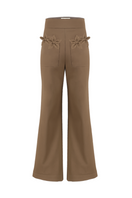 Tan floral pants by Ana + Maria featuring a vibrant floral pattern and relaxed fit, shown on a model.