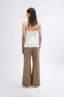 Tan floral pants by ANA + MARIA with a relaxed fit, featuring a vibrant floral pattern and lightweight fabric.