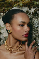 Gold and blue flow earrings by Jude Benhalim featuring elegant, flowing design with metallic finish.