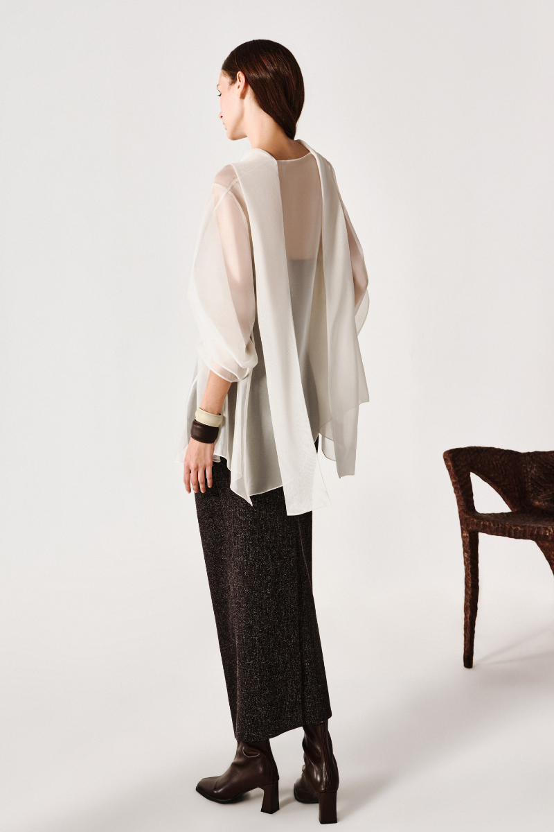 Flowing draped shirt by Leicia featuring lightweight fabric and relaxed fit, shown on a hanger with a soft, flowing silhouette.