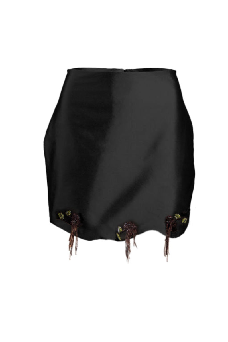 Black fold skirt by Yassmin Saleh, stylish mini skirt with a fold detail, shown from the front.