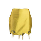 Green fold mini skirt by YASSMIN SALEH displayed with front ghost fold detail on a model.
