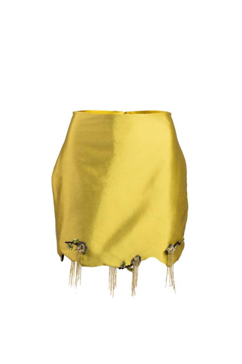 Green fold mini skirt by YASSMIN SALEH displayed with front ghost fold detail on a model.
