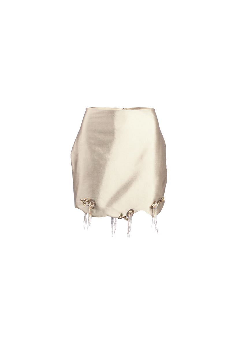 White fold mini skirt by YASSMIN SALEH featuring a stylish front fold design and a sleek, modern silhouette.