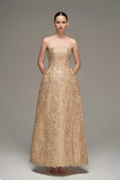 Beige lace bustier gown by I.H.F Studio, neatly folded with intricate lace details and elegant midi length.