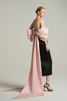 Black and light pink bustier gown by I.H.F Studio with a large bow at the back, shown in a stylish foldover midi dress design.