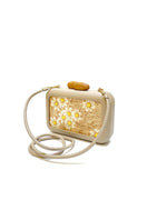 Beige clutch with daisy embroidery by Sy&Vie, featuring intricate floral design and elegant compact shape.