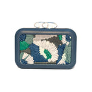 Blue Folhata Flora Grid clutch bag by Sy&Vie with a floral pattern, featuring a compact design and stylish appearance.