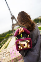 Sy&Vie Folhata Flora Grid Burgundy clutch with floral pattern, rectangular shape, and subtle texture.