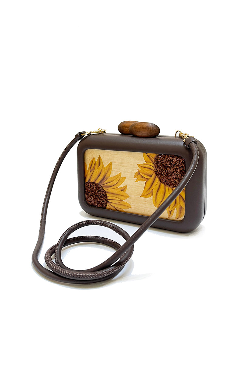 Brown clutch with sunflower embroidery from Sy&Vie, featuring intricate floral detailing and a stylish design.