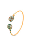 Green Sopo Milagro bangle bracelet by Álvaro Ávila featuring intricate design and polished gold finish.