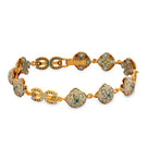 Green Manifiesto bracelet by Álvaro Ávila featuring layered cord design and decorative charms.