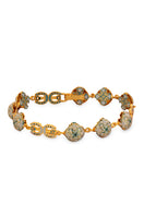 Green Manifiesto bracelet by Álvaro Ávila featuring layered cord design and decorative charms.