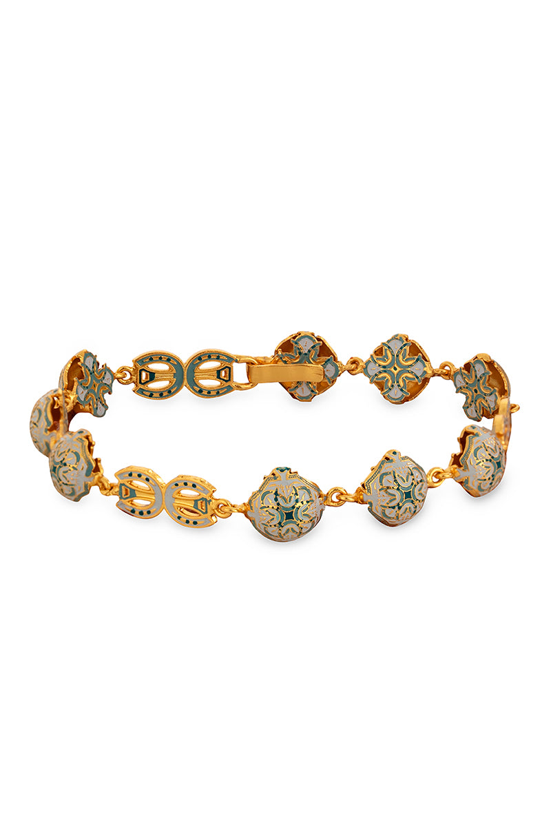 Green Manifiesto bracelet by Álvaro Ávila featuring layered cord design and decorative charms.