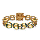 Green Maravilla wide bracelet by Álvaro Ávila featuring intricate designs and a polished finish.