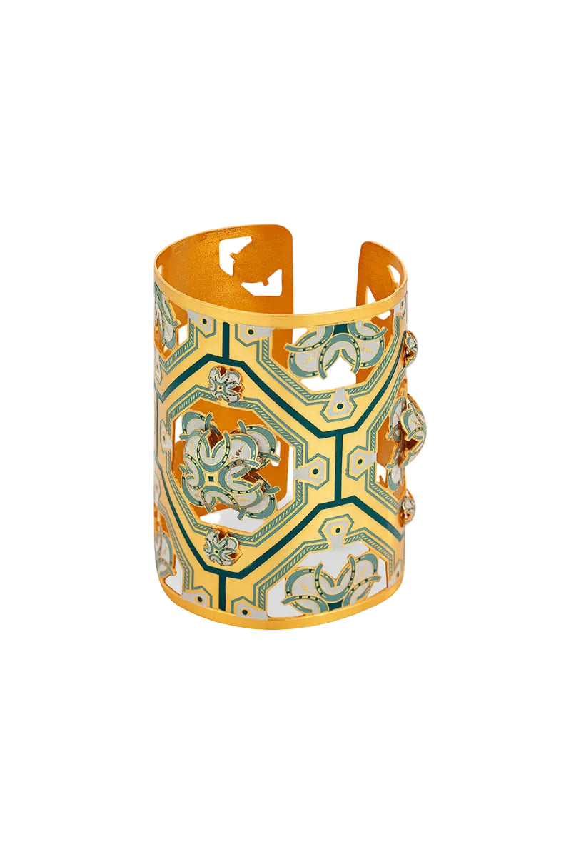 Green Fortuna cuff bracelet by Álvaro Ávila featuring a detailed oracle design on a sleek metal band.