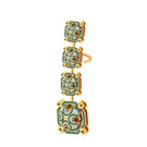 Green talisman ear cuff earrings by Álvaro Ávila featuring intricate design and metallic finish.