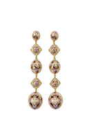 Lavender Amuleto Drop Earrings by Álvaro Ávila featuring elegant, elongated earrings with a delicate, artistic design.