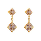 Lavender Campo statement earrings by Álvaro Ávila featuring bold, artistic design with intricate details on gold-tone earrings.