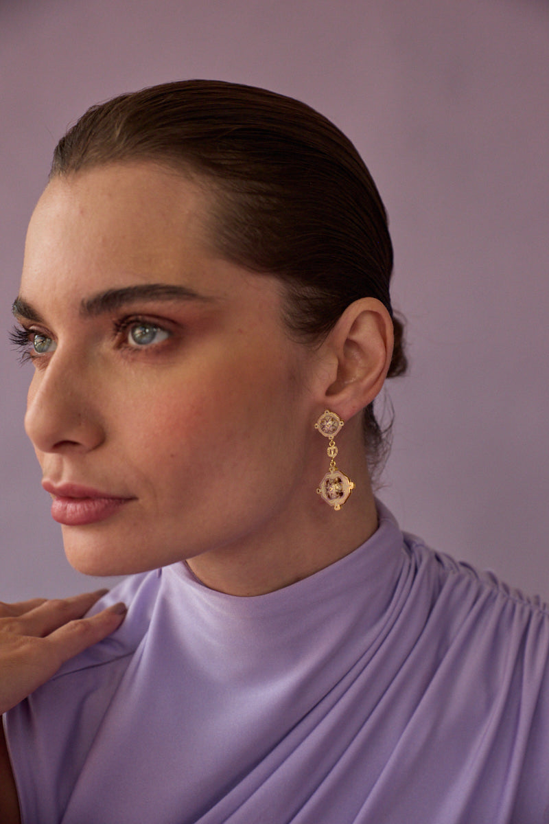 Lavender Campo statement earrings by Álvaro Ávila featuring intricate design and dangling elements, displayed on a white background.