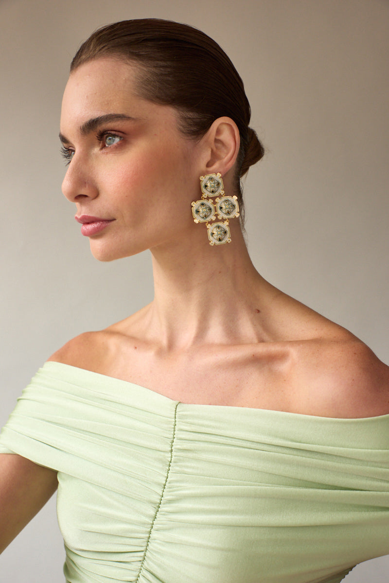 Silver drop earrings by Álvaro Ávila featuring elegant green stone accents in a stylish jewelry design.