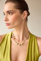 Green gemstone necklace by Álvaro Ávila featuring a delicate chain and elegant pendant design.