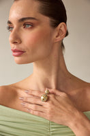 Green enamel Estrella Double Egg Ring by Álvaro Ávila featuring star-shaped design and silver band.