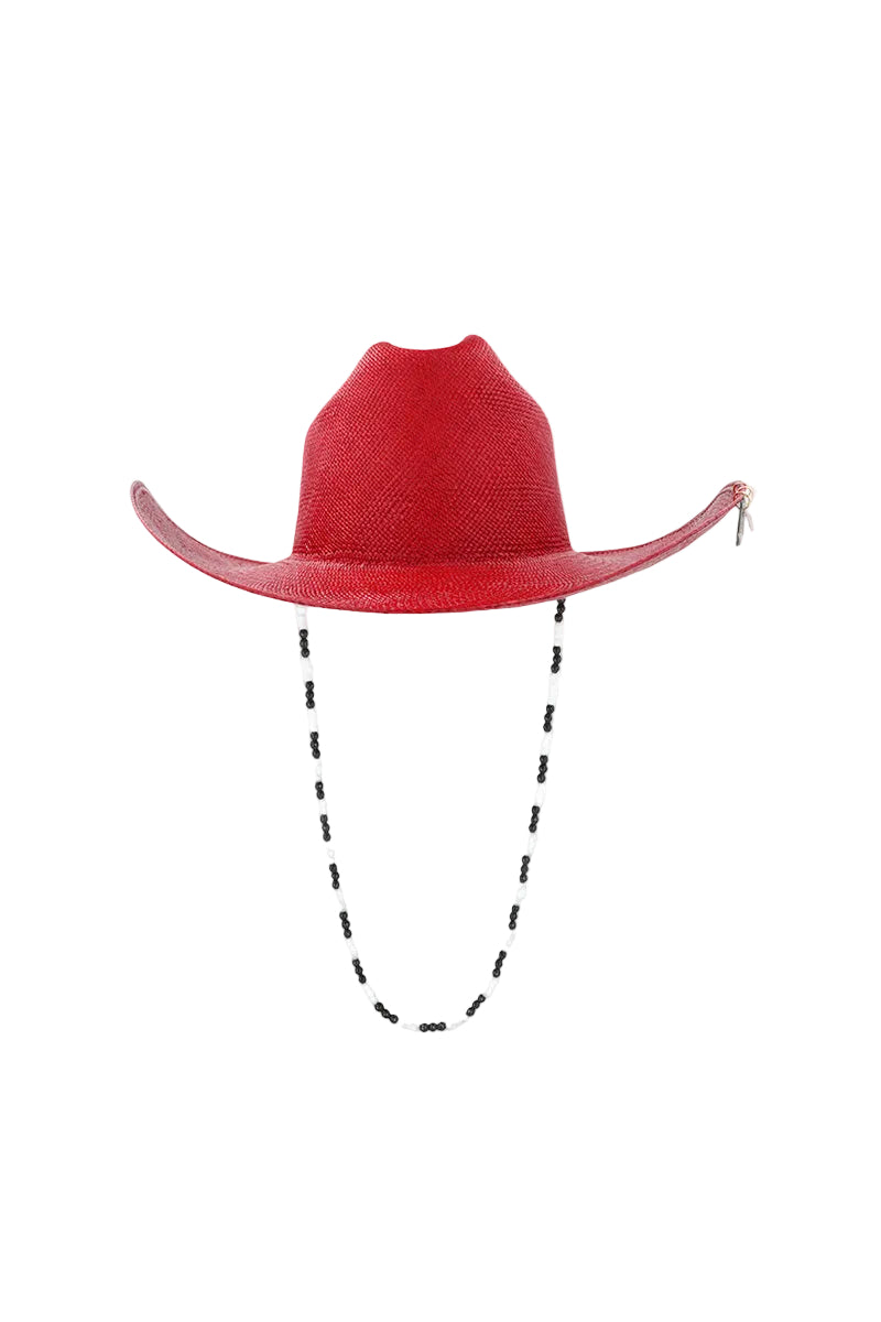 Ser Fortune Finds hat, stylish wide-brim hat with decorative band, shown in a natural outdoor setting.