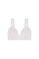 White patterned bralette from Ellipse Lingerie with delicate lace details, soft fabric, and adjustable straps.