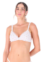 White patterned bralette from Ellipse Lingerie with delicate lace details, designed for comfort and style.