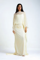 Off white Francesca maxi dress by Deme By Gabriella, flowing fabric, V-neckline, and elegant sleeveless design.