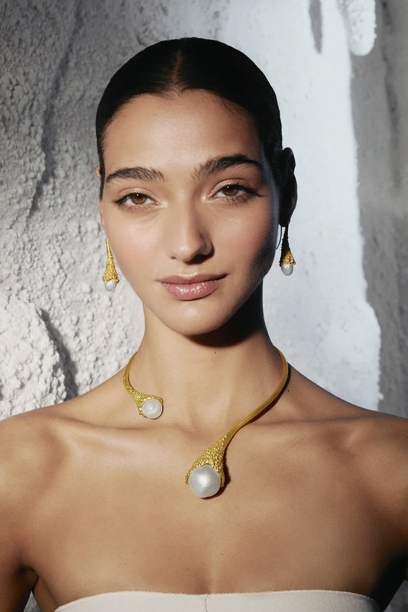 Gold and white frost-inspired necklace by Jude Benhalim, featuring intricate design and delicate chain, perfect for elegant styling.