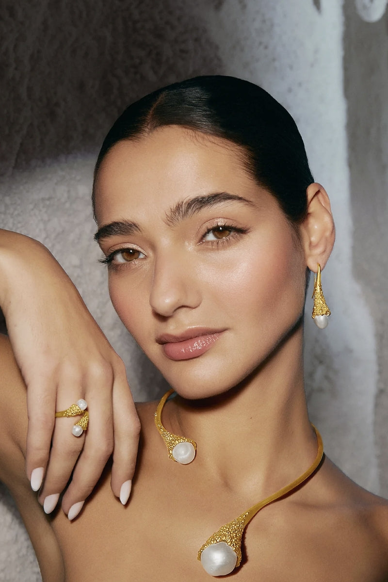 Gold and white frost necklace by Jude Benhalim featuring delicate chain and frost-inspired pendant design.